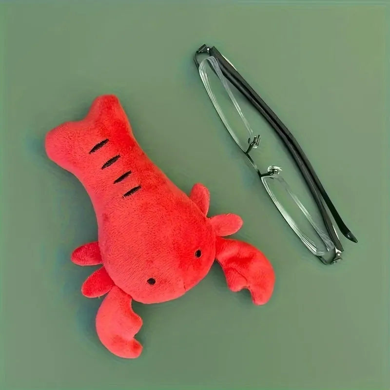 Red crab lobster squeaky stuffed chew toy for small and medium-sized dogs on a white background.