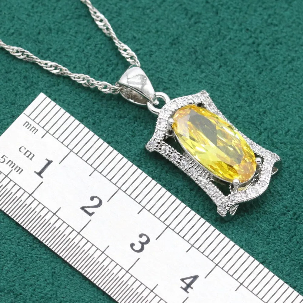 Yellow and olive alloy zircon jewellery set for women showing necklace, earrings, ring, and bracelet on display.