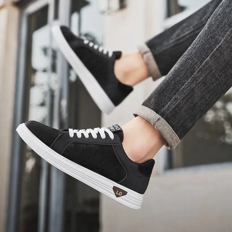 Men's black snake pattern PU leather sneakers with round toe and flat rubber sole.