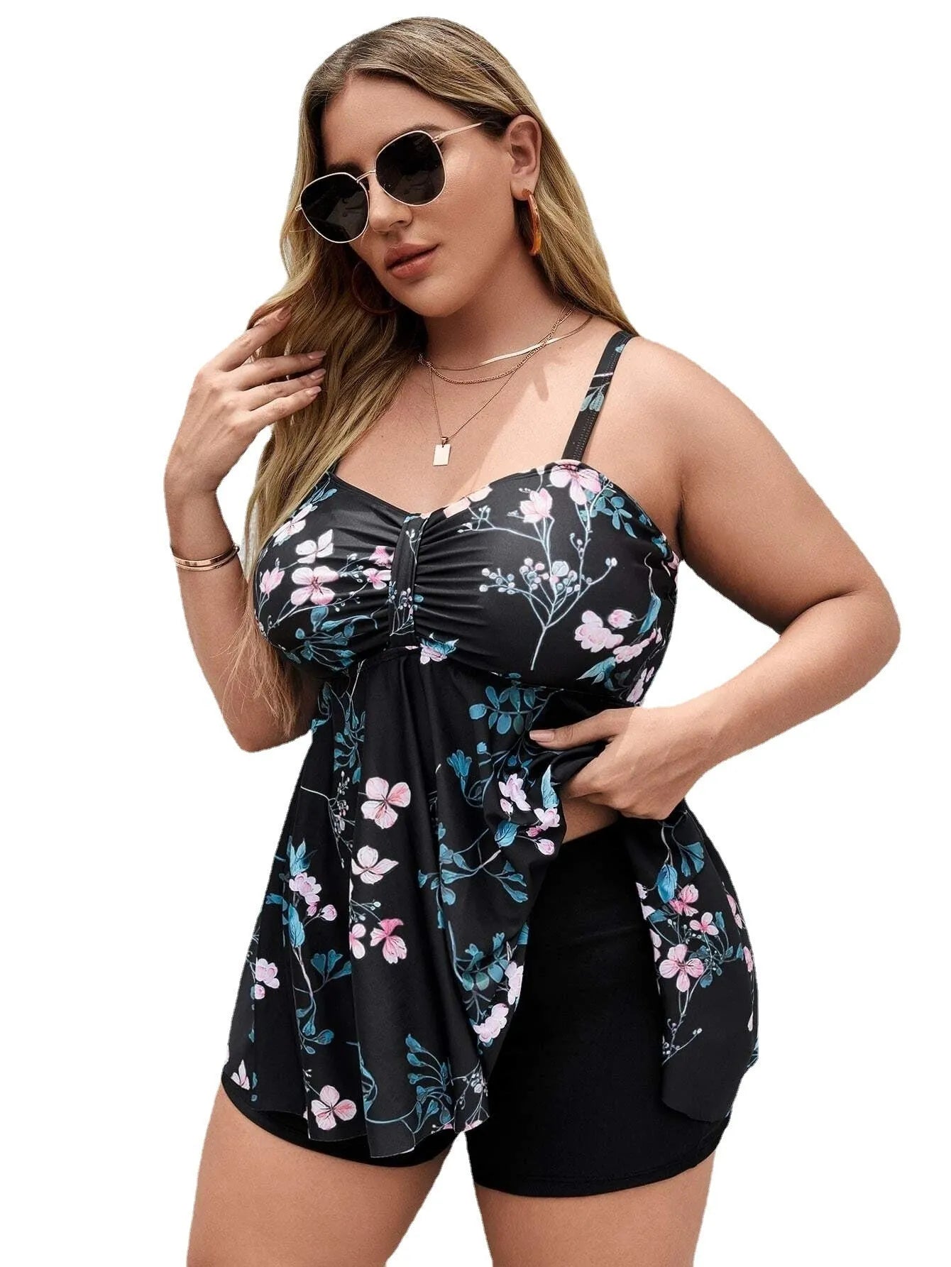 Women's floral print one-piece swimsuit on a hanger, showing split colour pattern.