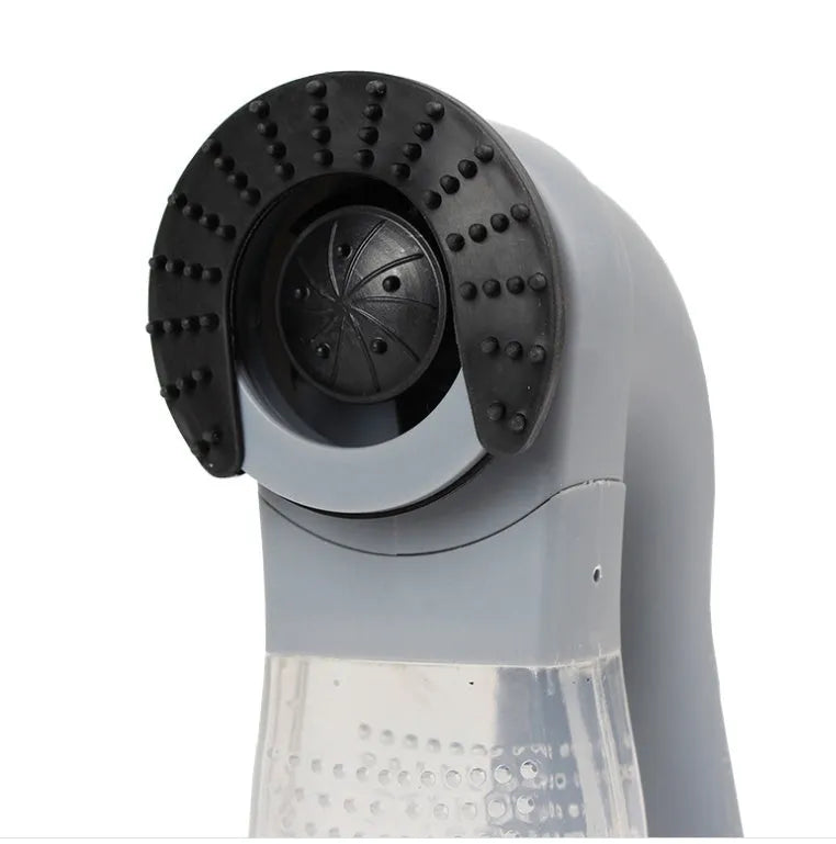 Grey handheld electric pet hair vacuum cleaner with soft rubber brush head for grooming dogs and cats