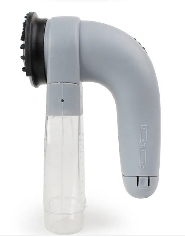 Grey handheld electric pet hair vacuum cleaner with soft rubber brush head for grooming dogs and cats