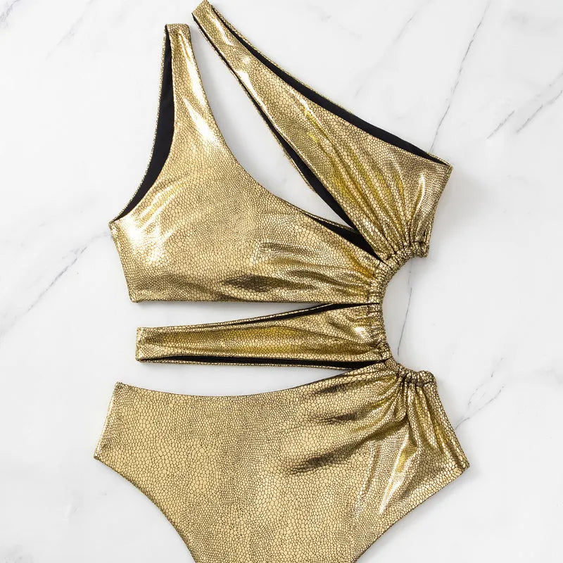 Women's gold backless one-piece swimsuit with spandex construction for swimming activities