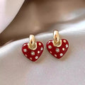 Pair of heart-shaped ear studs in zinc alloy with electroplated finish, retro style for women