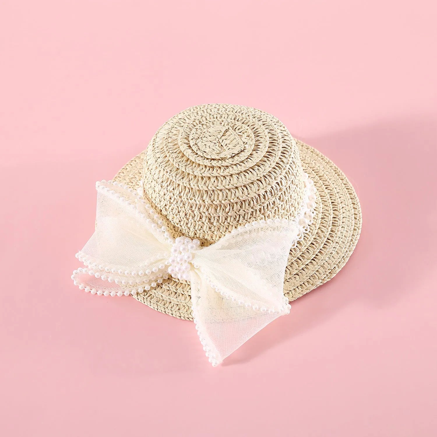 Woven Lafite leaf cat hat with pearl butterfly bow on a pink background, showing S and M size options.