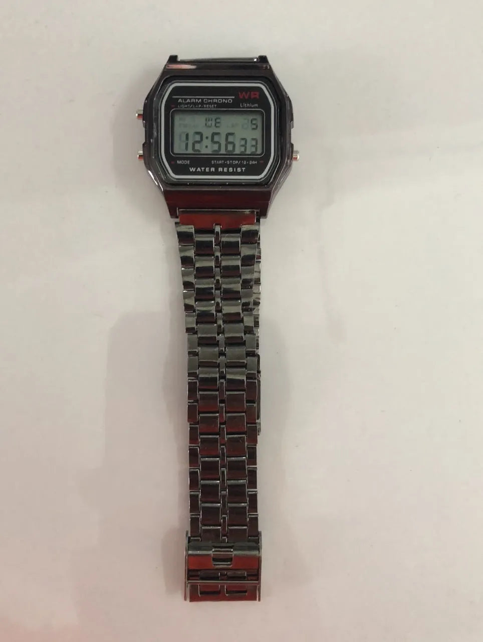 WR F91W steel band electronic watch with square dial and number display on stainless steel strap