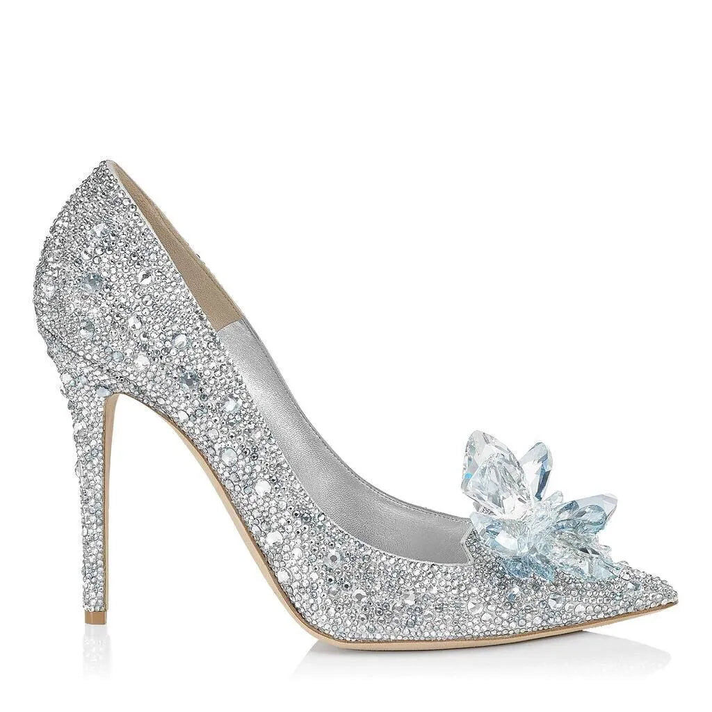 Gold women's pointed toe high heels with rhinestone decoration and a stiletto heel.