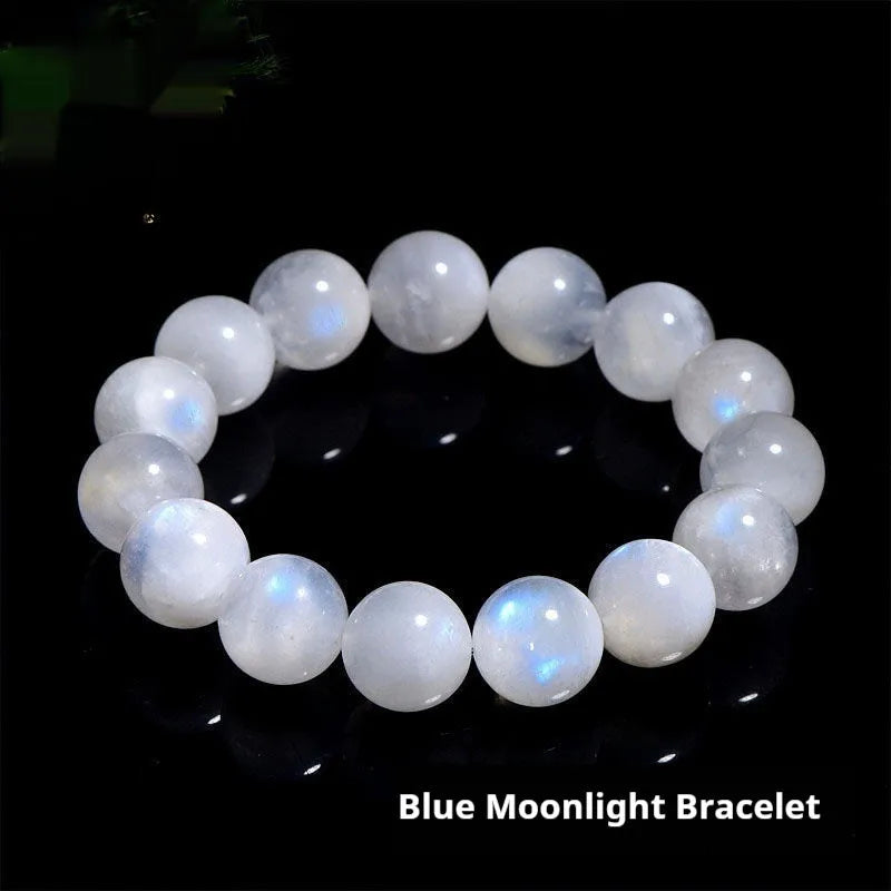 Natural blue moonlight round bead moonstone bracelet showing polished gemstone beads on wrist
