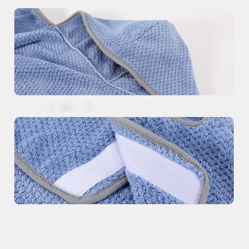 Blue quick drying dog bath robe towel with adjustable waistband placed on a fluffy mat