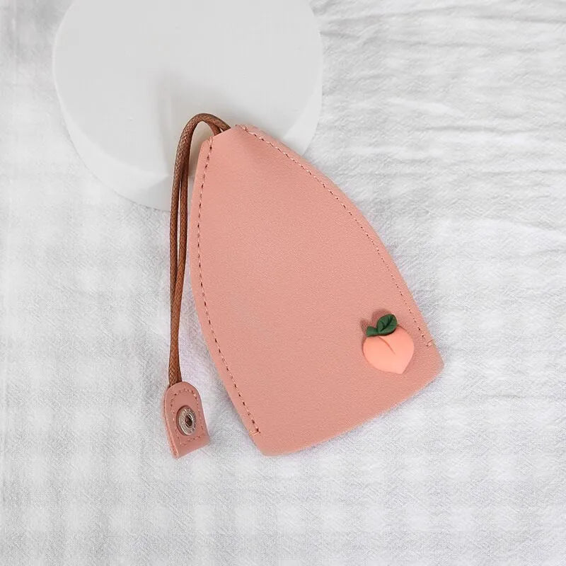 Cartoon design pull-out key case for car keys in PU leather.