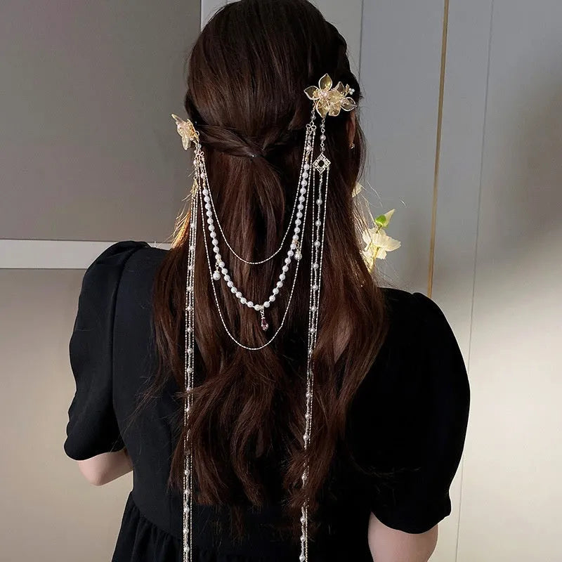 Gold grip hairpin with white pearl diamond flower and long clear tassel decoration.