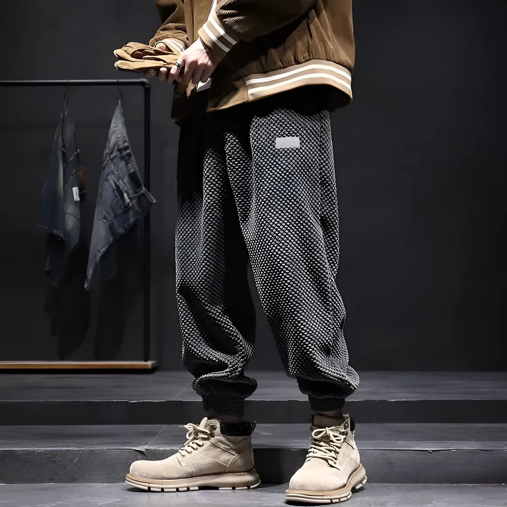Men's grey ankle-tied straight leg casual sweatpants laid flat