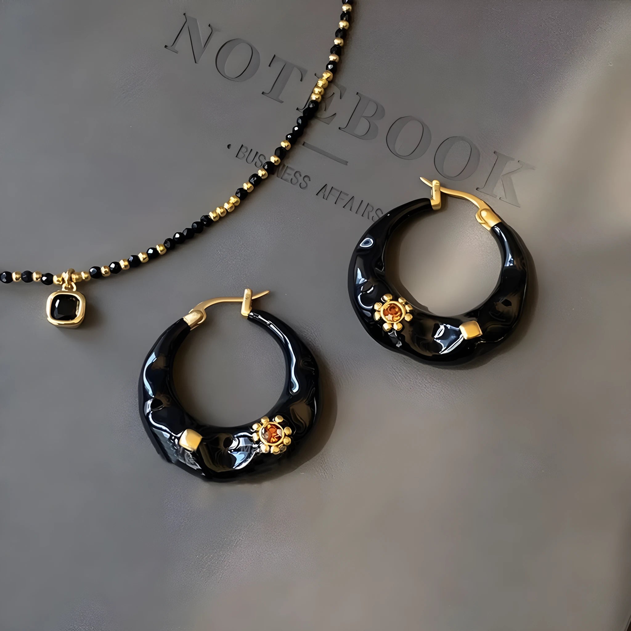 Hong Kong style retro ear studs with alloy construction and black rhinestone detailing