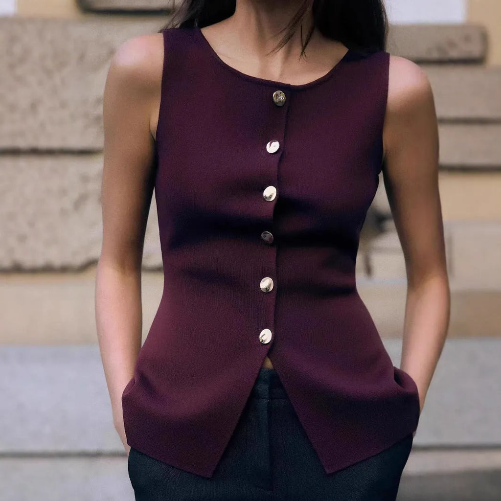Dark red slim fit sweater vest with gold buttons and a raised 3D pattern, laid flat.