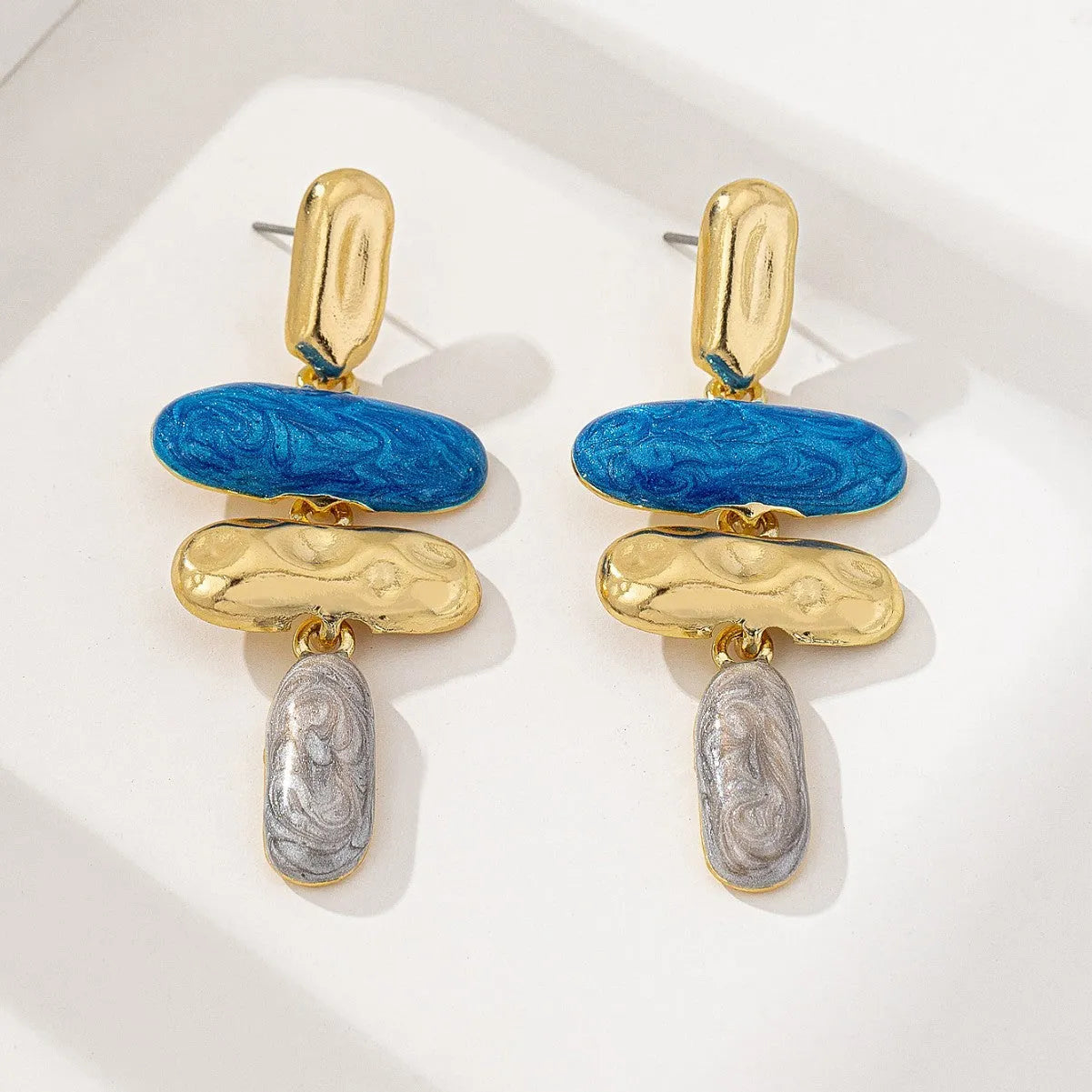 Geometry shaped stud earrings with multicolour electroplated finish on zinc alloy