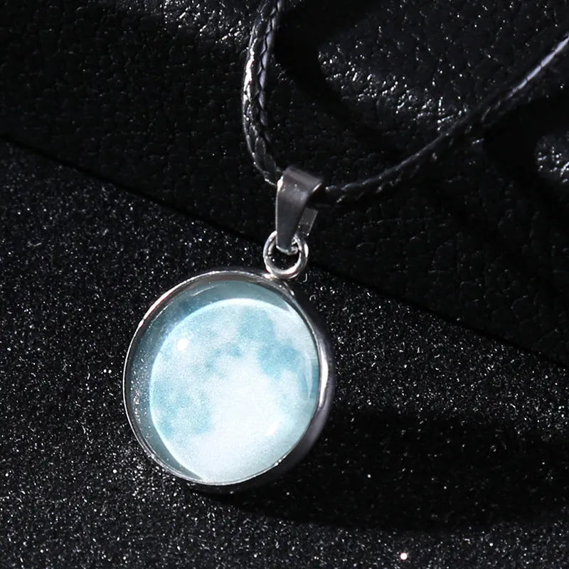 Luminous moon and constellation night sky pendant on an extendable alloy necklace chain.