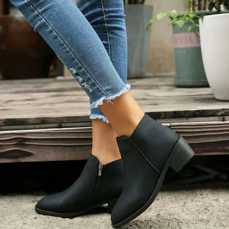 Women's chunky mid heel suede ankle boots with side zipper in off-white, front view