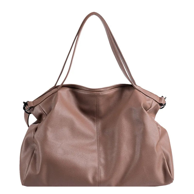 Large PU leather messenger bag with adjustable shoulder strap showing interior phone pocket organisation