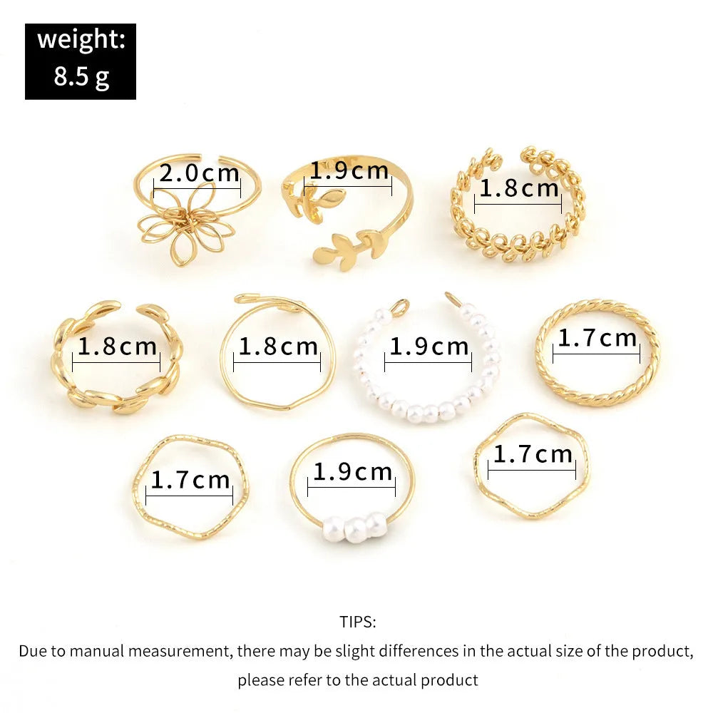 Gold-coloured alloy ring with openwork floral design and glossy electroplated finish