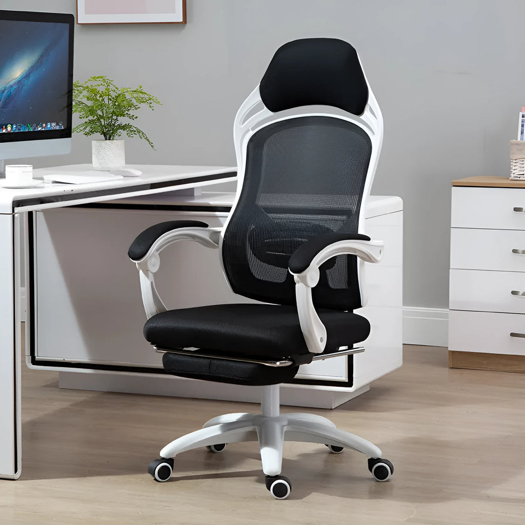 Ergonomic computer gaming chair with black frame, footrest, linkage armrests, and nylon wheels on a hard floor.