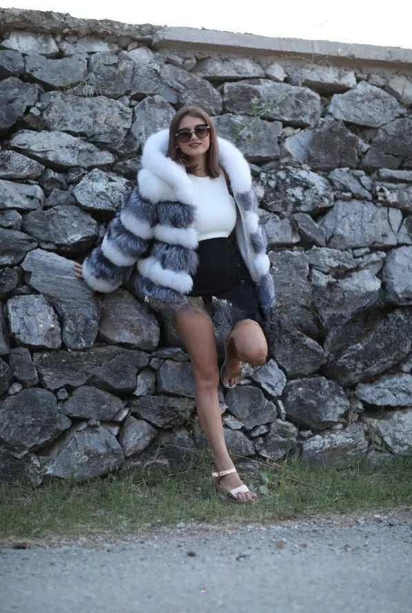 Loose fit women's hooded coat in artificial fur, shown in brown colour, street fashion style.