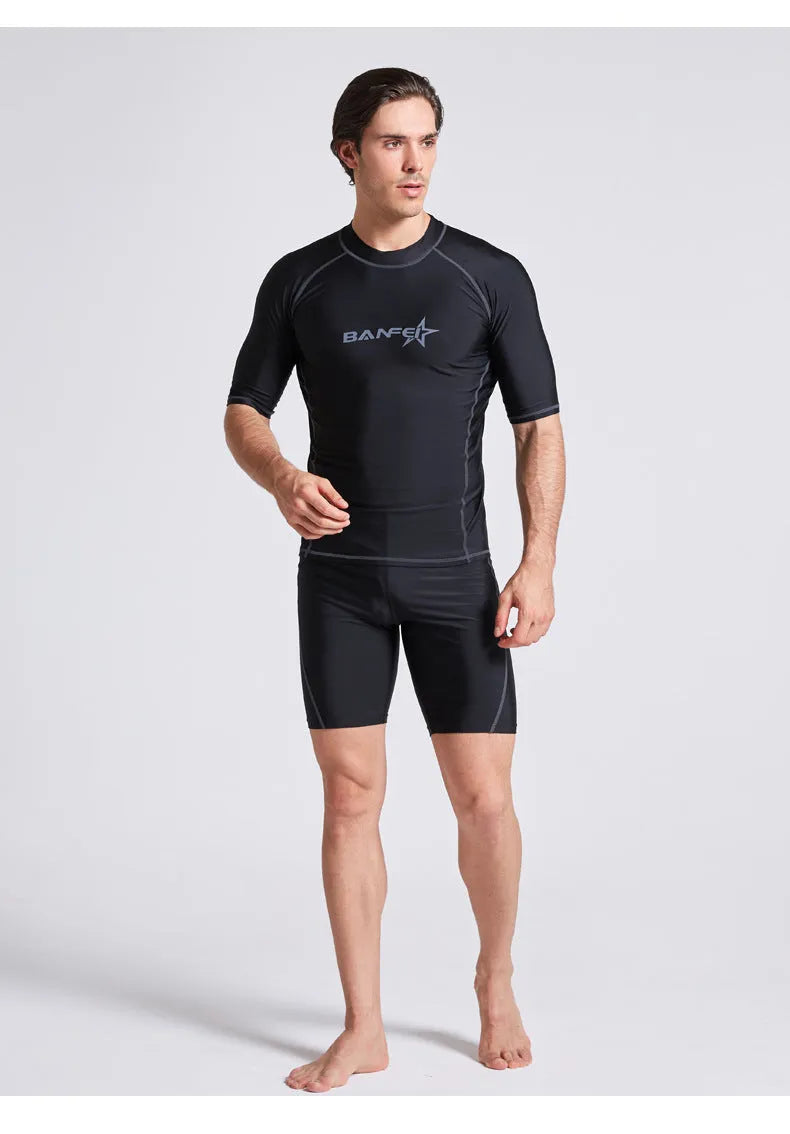 Men's quick-drying half sleeve swim top and pant set in nylon fabric on a white background.