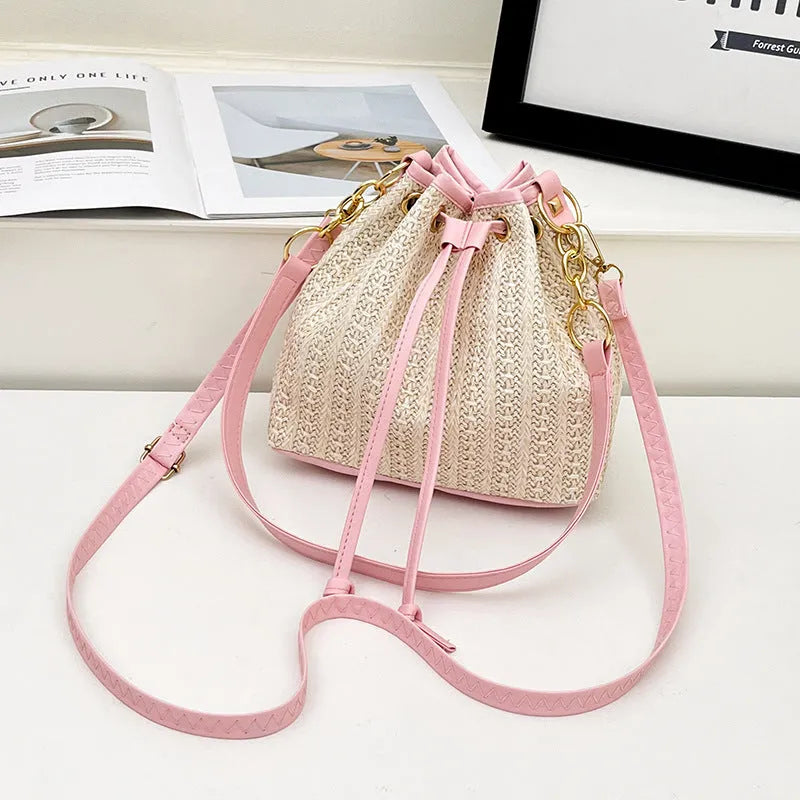 Straw woven women's crossbody shoulder bag with contrast colour trim and phone pocket