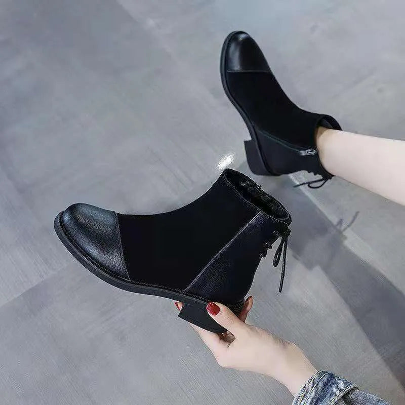 Black women's Martin boots with side zip, round toe, and knee-length shaft