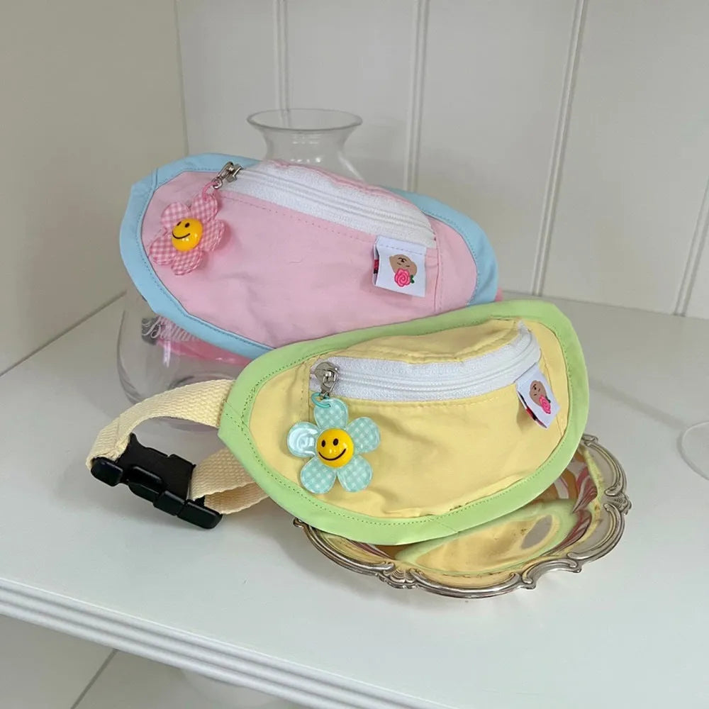 Backpack-style pet waste bag dispenser in messenger bag design showing S and M size options