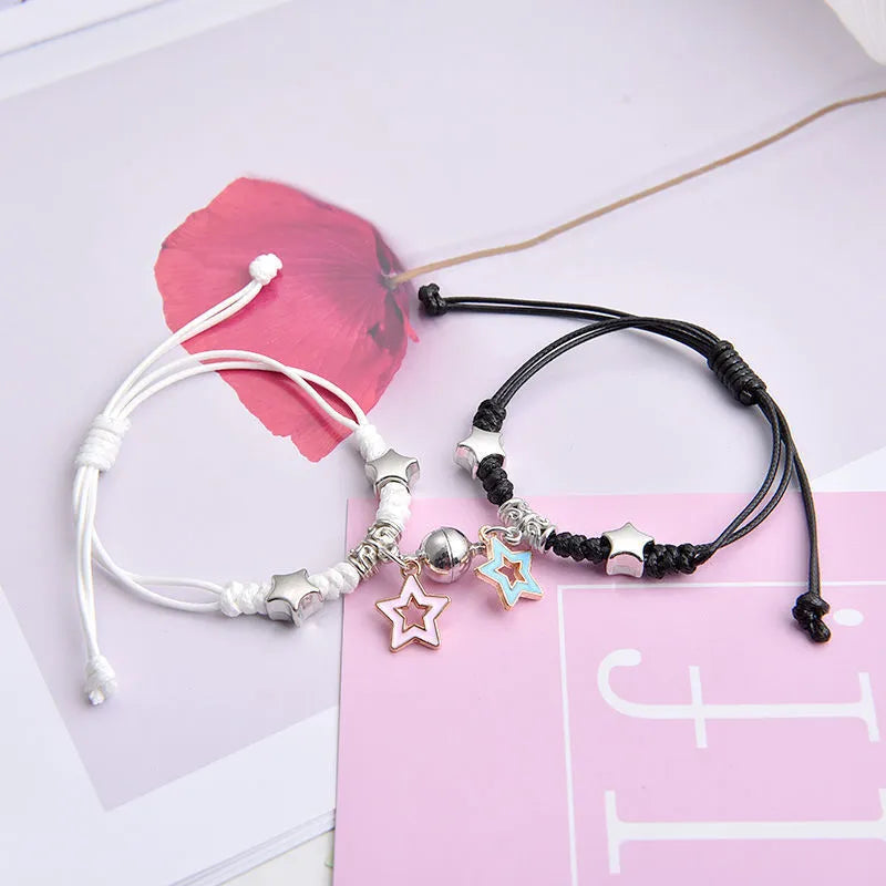 Alloy magnetic suction bracelet pair for couples with symbolic design options