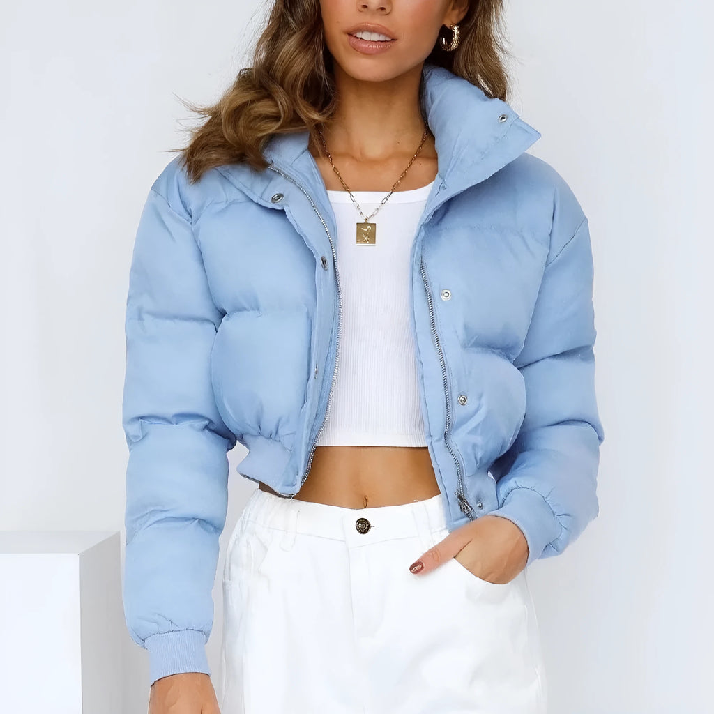 Women's loose fit long sleeve polyester jacket in blue, shown on a hanger.