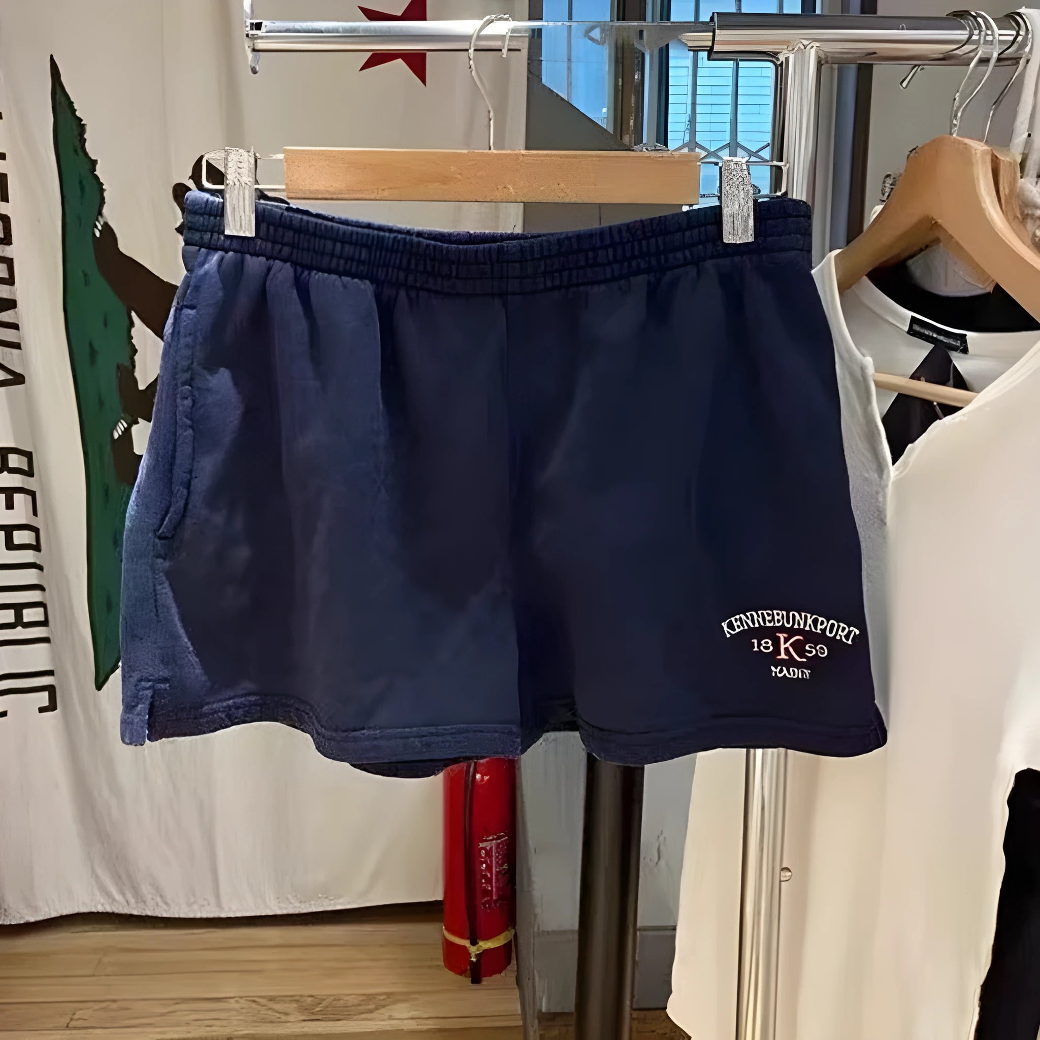 Women's navy blue cotton sports hot pants with white flag embroidery and high top styling