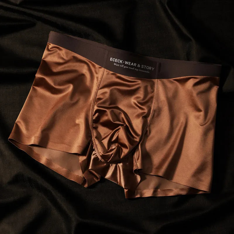Men's solid colour Ice Silk seamless underwear in a selection of colours including white, brown, gray and blue.