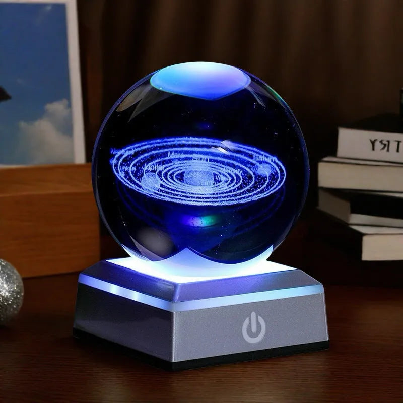 Transparent white crystal ball night light with 3D inner carving of Milky Way on black square colourful base