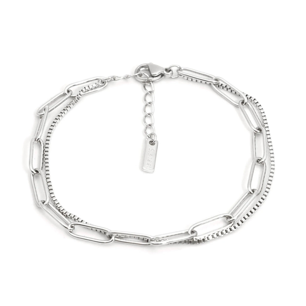 Geometric double layer stainless steel bracelet in gold or silver, showing Ins Cold Style design with linear elements.
