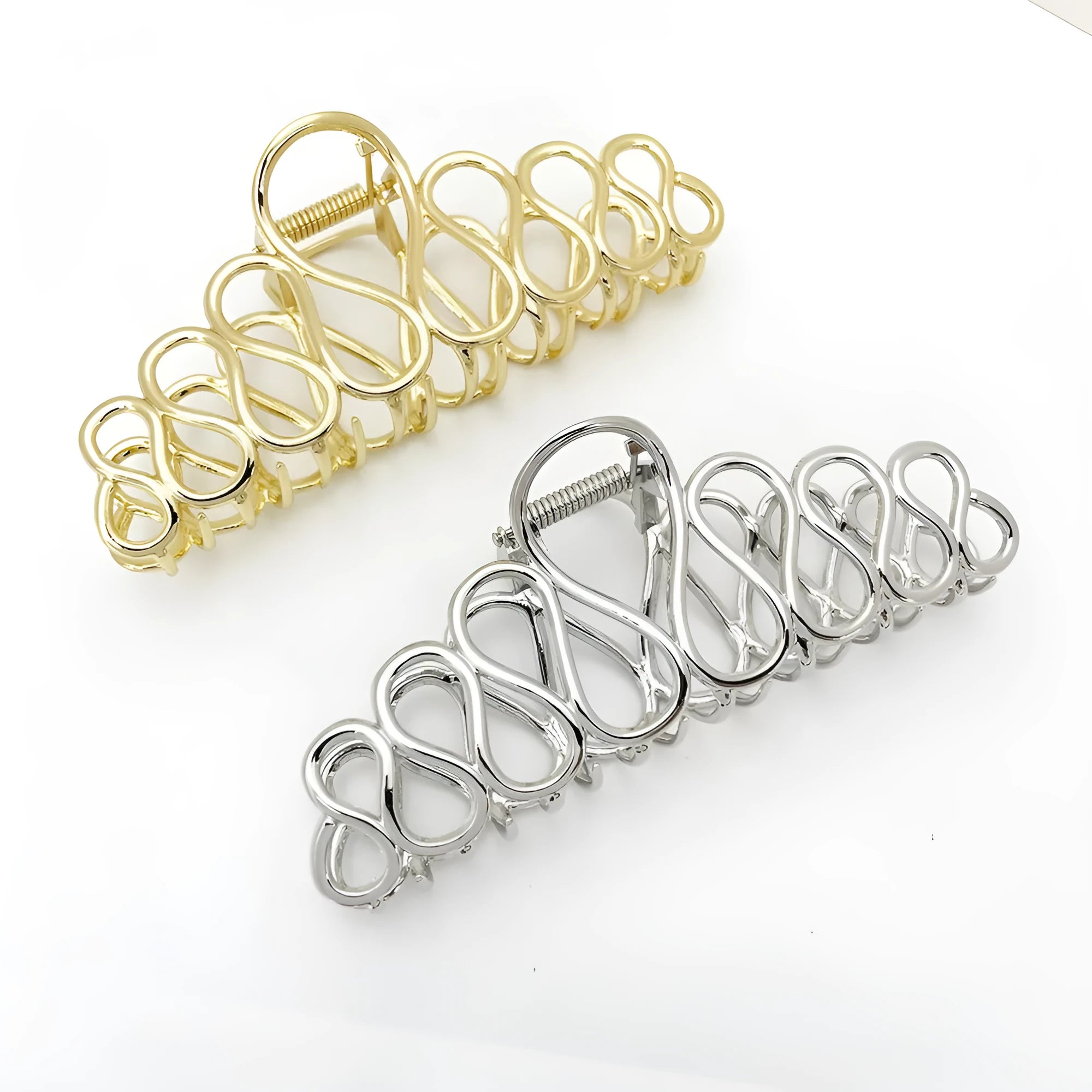 Minimalist large hair clip with electroplated finish and tassel detail.