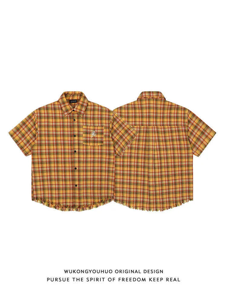 Yellow plaid short sleeve shirt with embroidered pocket detail in loose fit