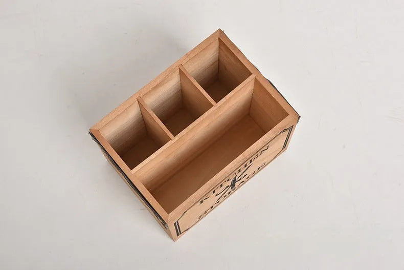 Open-top wooden kitchen storage box with internal grid divider for knives, forks, and chopsticks.