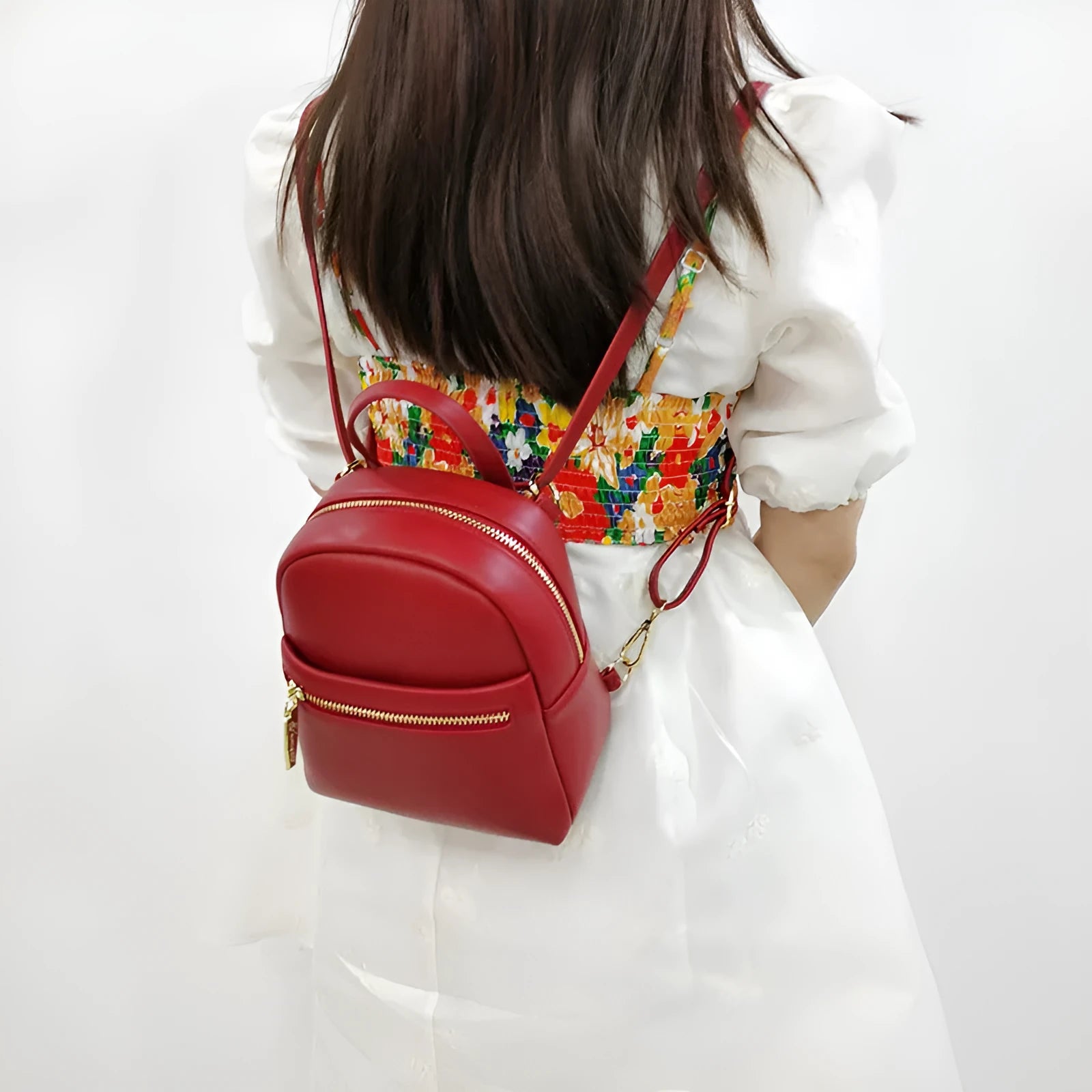 Soft PU mini backpack in street style, shown in one of six colours with contrast details and external 3D pocket.