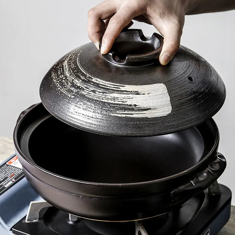 Ceramic casserole pot with lid, 2800ml size, on gas stove, uncoated clay finish