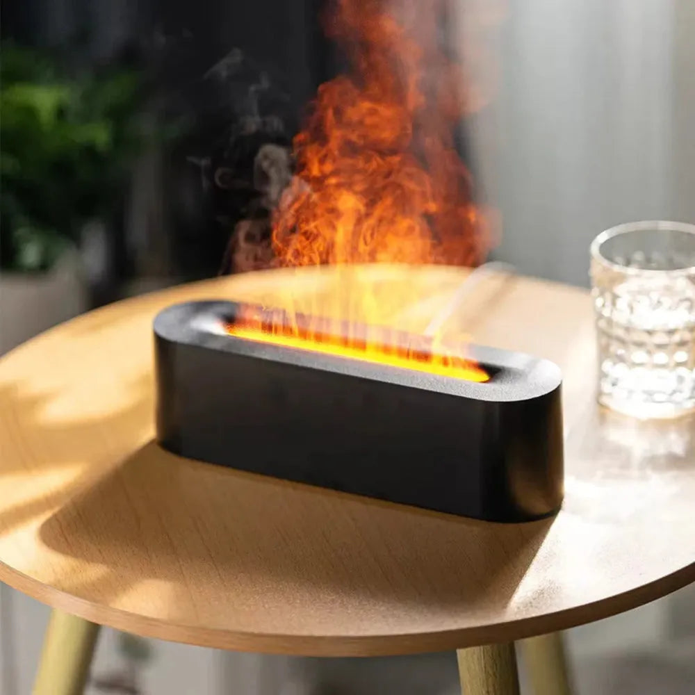 Square black creative lava USB humidifier and aroma diffuser with colourful LED flame lighting on a desk.