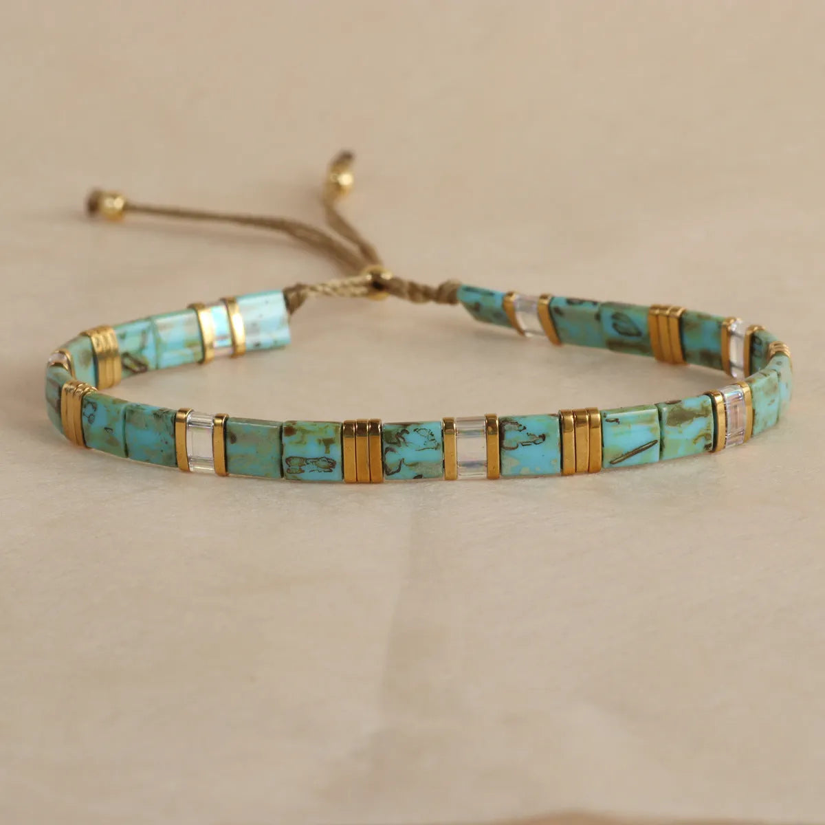 Geometric glass bead bracelet with pull adjustment in five colour options