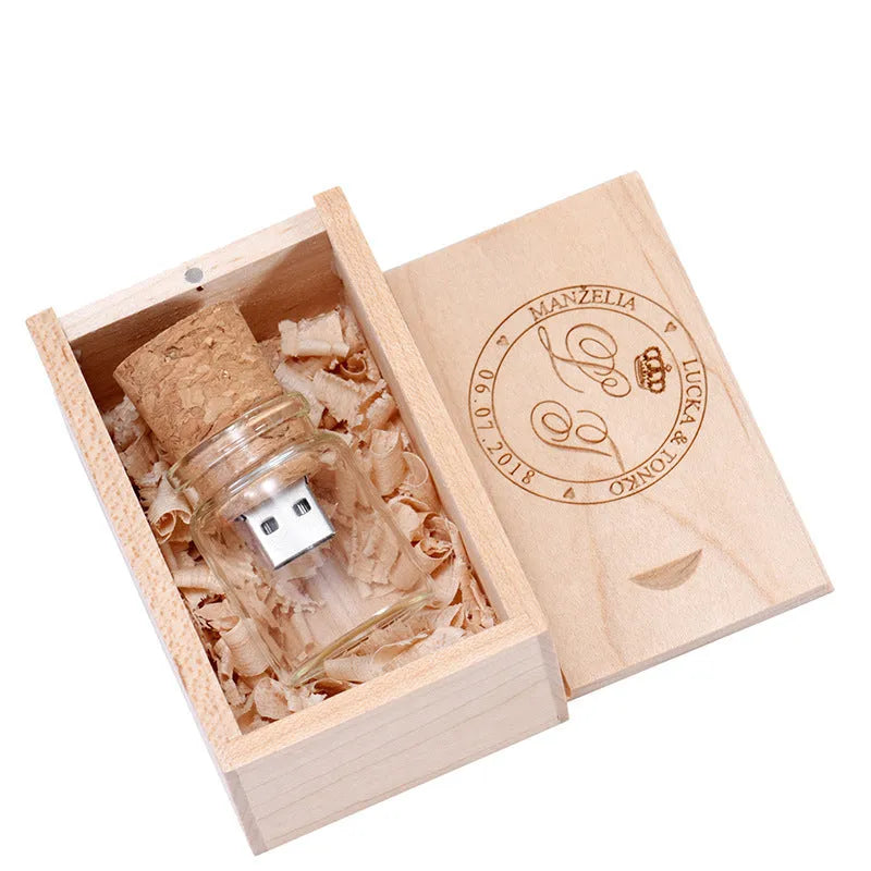 Chocolate brown wooden personalised USB memory stick shaped like a drift bottle, showing custom text engraving.