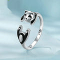 Sterling silver adjustable panda ring with white gold plating showing open bracelet design