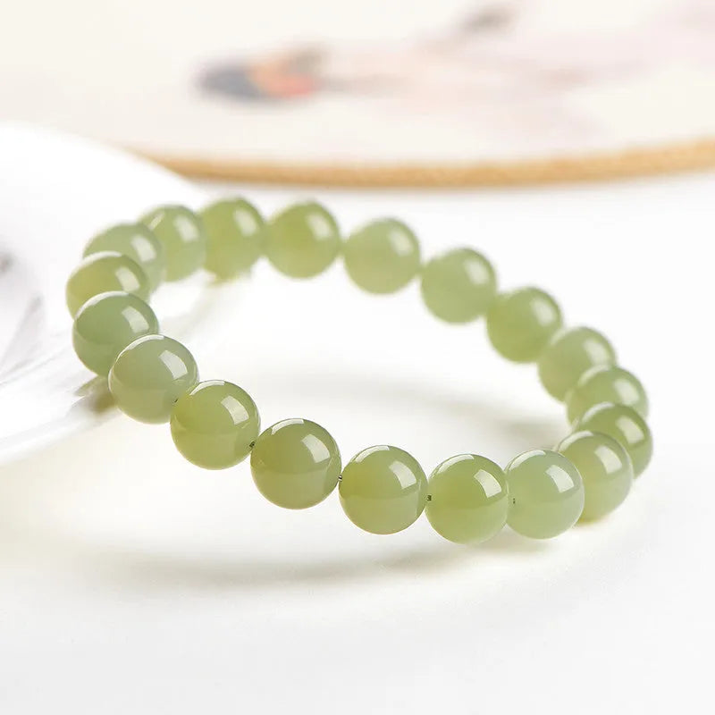 Polished Hetian jade bead bracelet showing deep water clear and light water clear colour options.