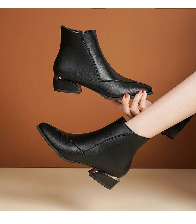 Women's chunky heel Martin boots in black with side zipper and leather stitch detail
