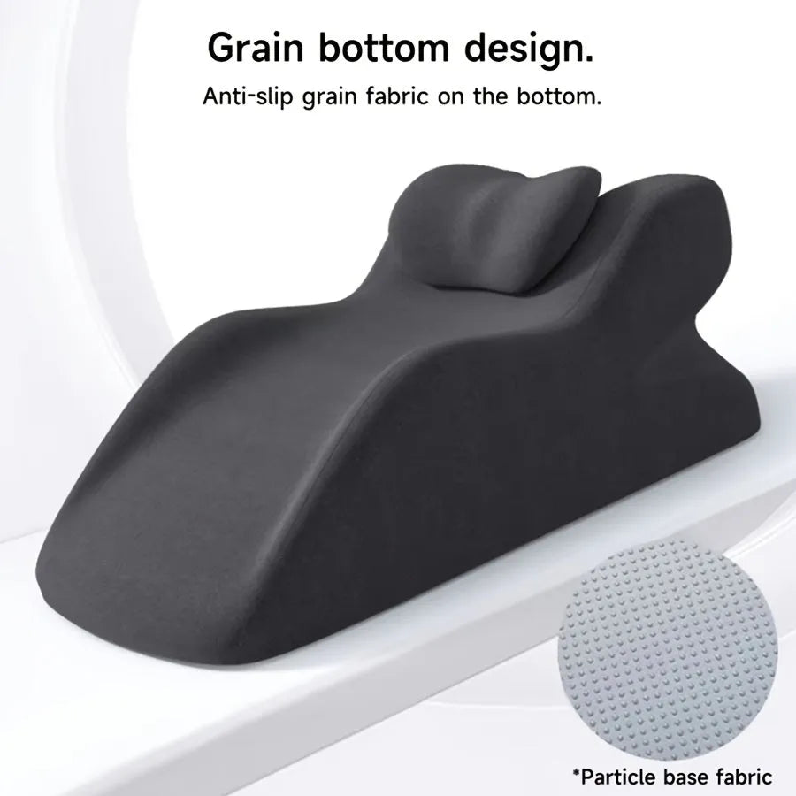 A stomach sleeping pillow shown in one of four colour options: blue, dark grey, green, or light grey.