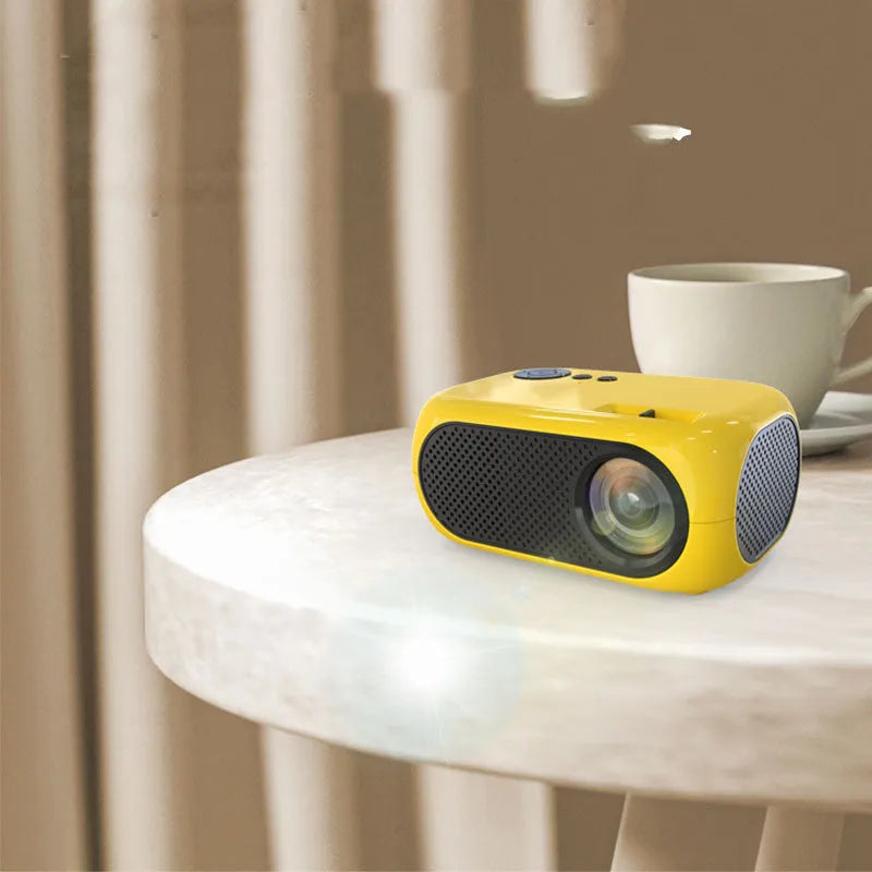 M24 micro mini portable projector showing compact design with gold and white colour options