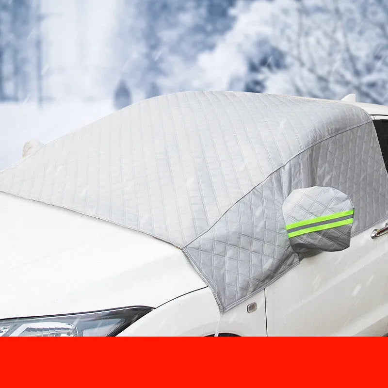 Magnetic anti frost car snow cover made from aluminium foil with magnets and reflective strips protecting a windscreen