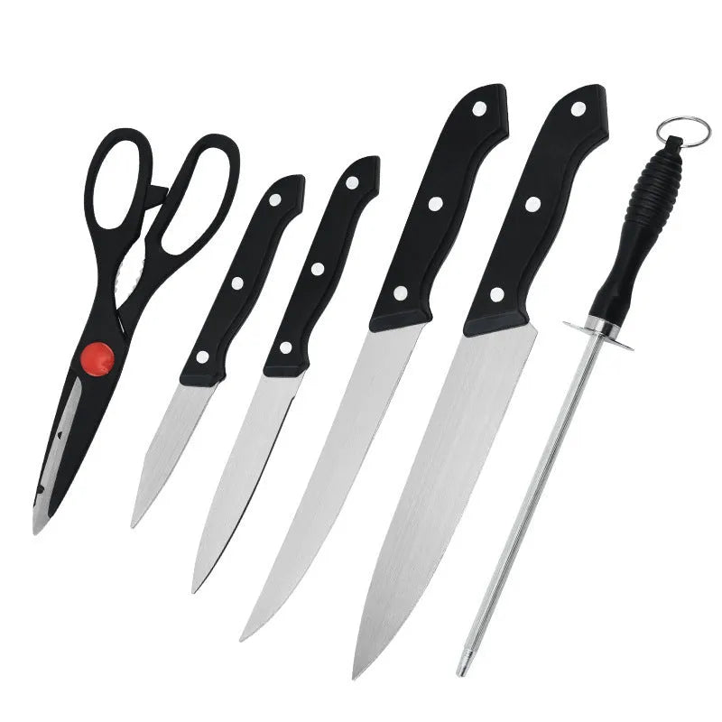 Stainless steel knife with 17.5cm blade and black A-style cutting board on kitchen countertop